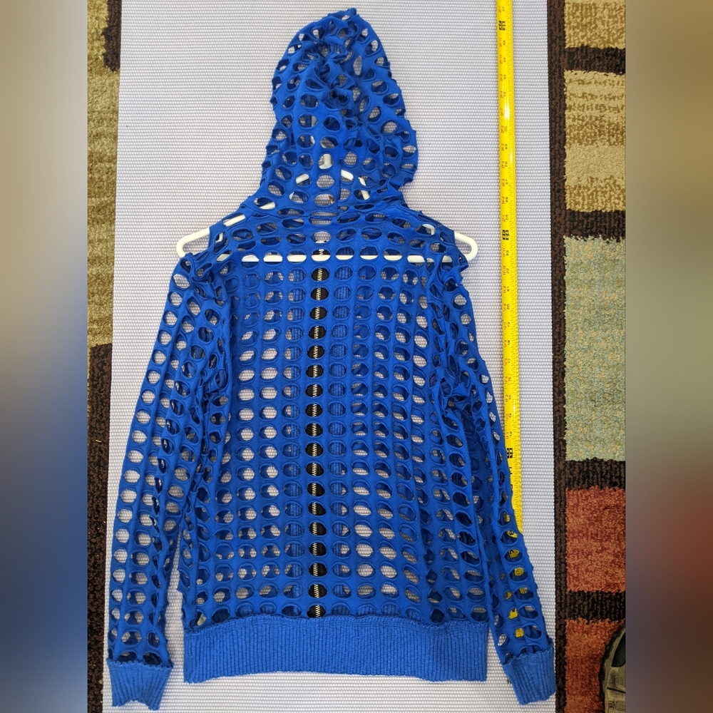 Bright blue hoodie with holes